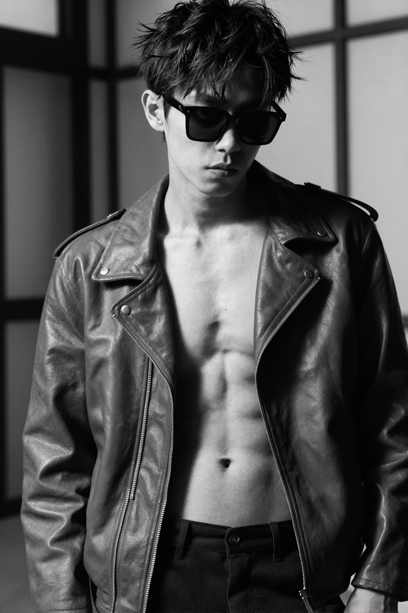 Black-and-white shot of a model in a leather biker jacket