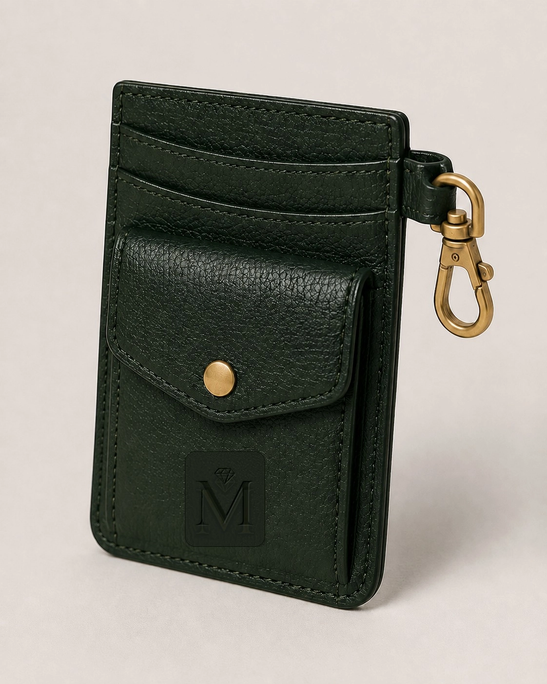 Deep green pebbled-leather cardholder with snap pocket and brass clip